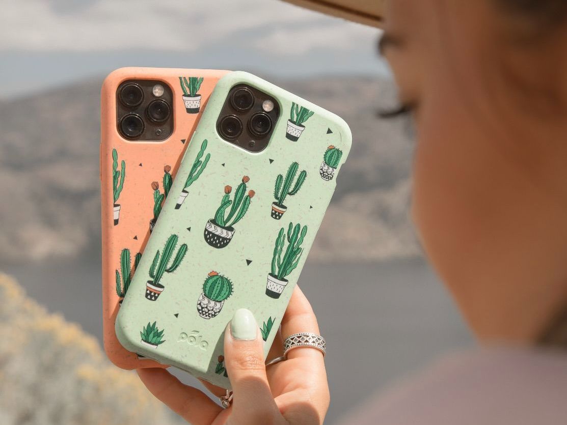A woman holding up two phone cases